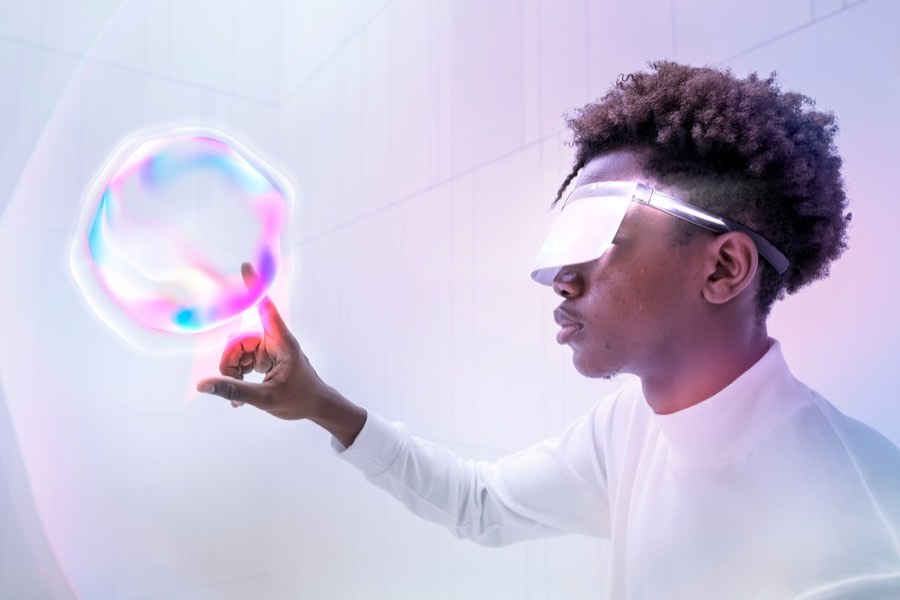 A person wearing a visor interacting with a floating translucent interface